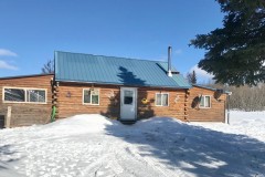 Log cabin on 5 acres off grid maintained road
