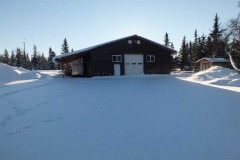 Beautiful Alaska style home with large shop, green houses, and Rv parking area.