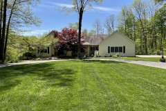 Land for sale outside Batesville, IN with exquisite 5000+ sq ft house on over 7 acres with a pond.